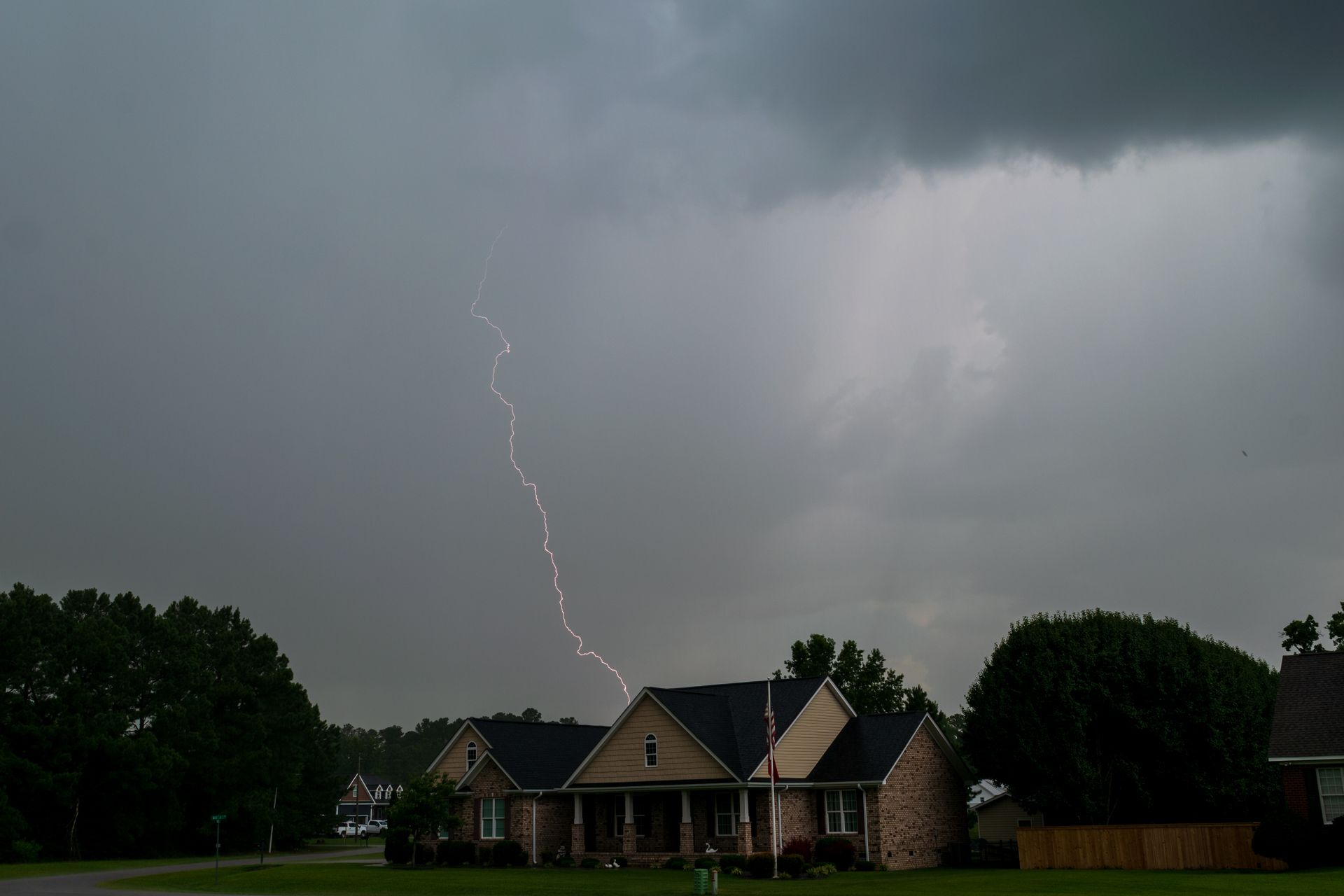 Lightning over a house before a storm